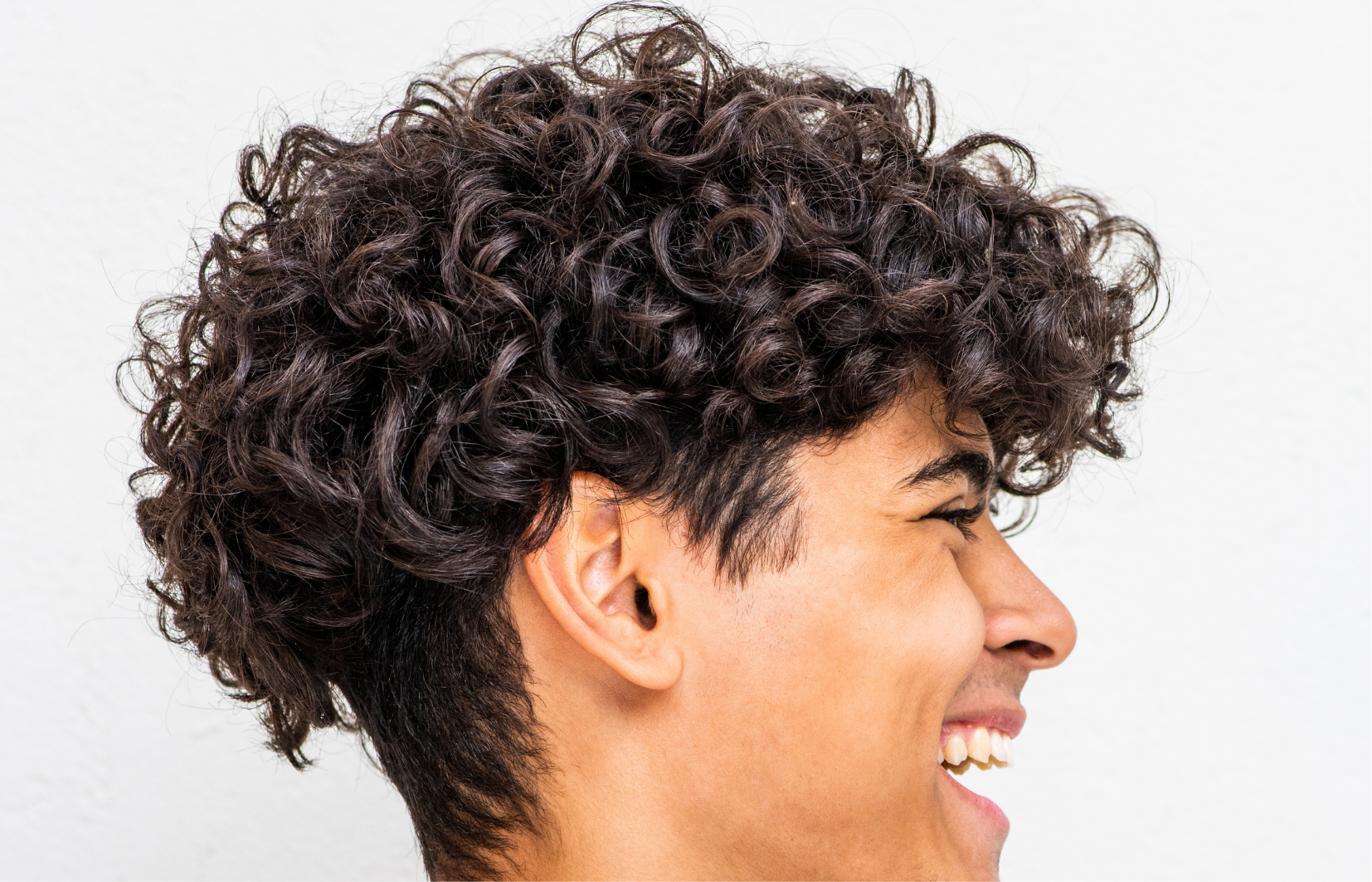 Show your curls with a curly high top, a stylish choice for natural texture and volume.