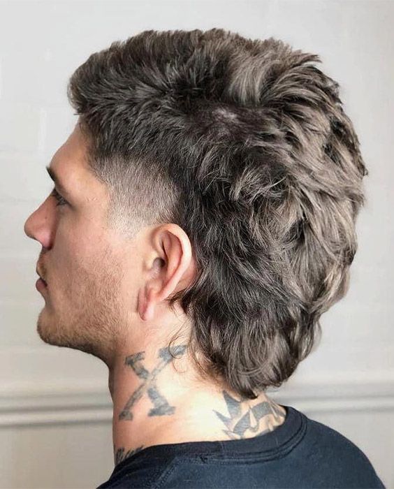 Revive the retro charm with a modern twist in the mullet hairstyle.
